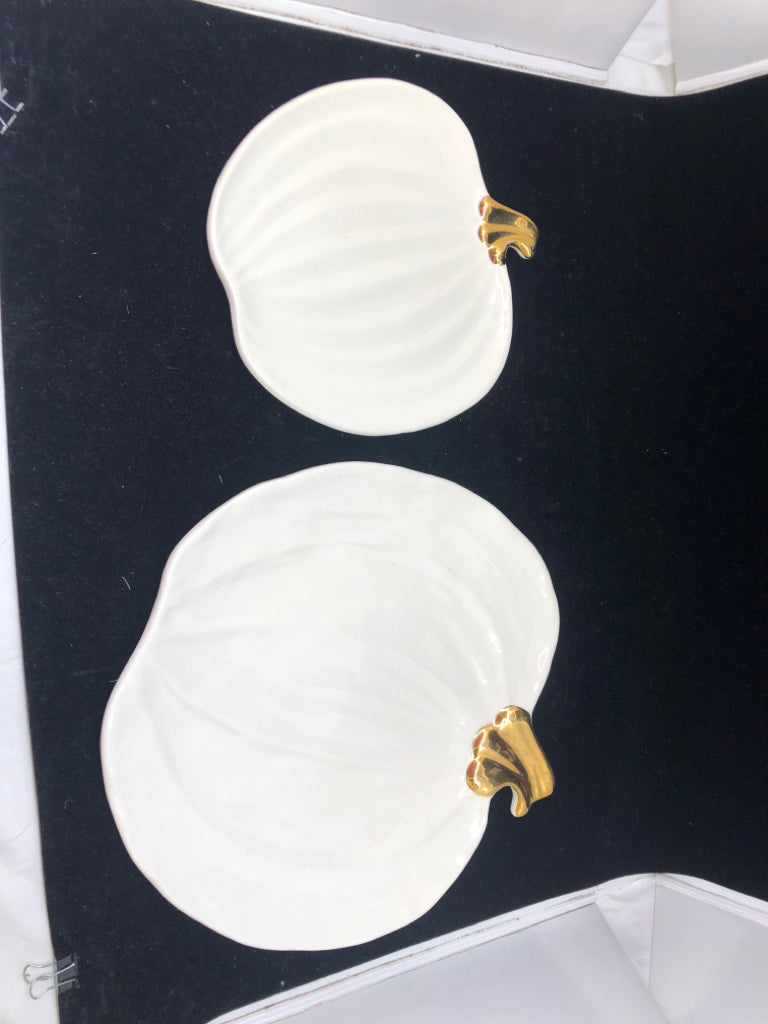 2 WHITE AND GOLD ACCENT NESTING PUMPKINS.