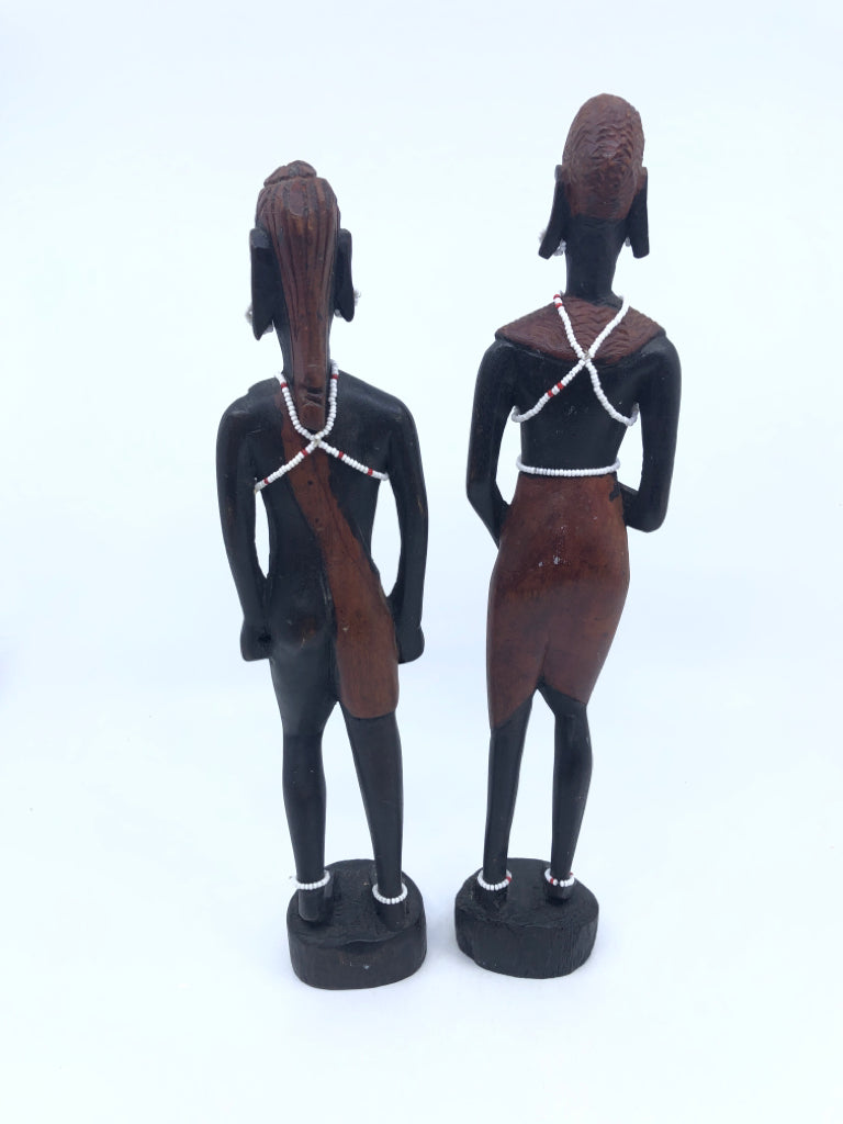 2-WOODEN MAN AND WOMAN CARVED FIGURES W BEADED JEWELRY.