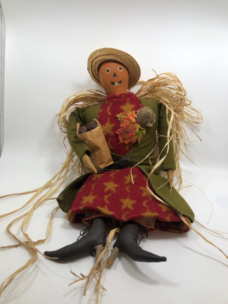 SCARECROW WOMAN W/BAG OF CHESTNUTS.