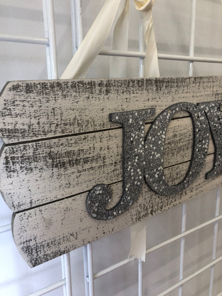 SILVER SPARKLE JOY WALL ART W/ FAUX WHITE WOOD BACKGROUND.