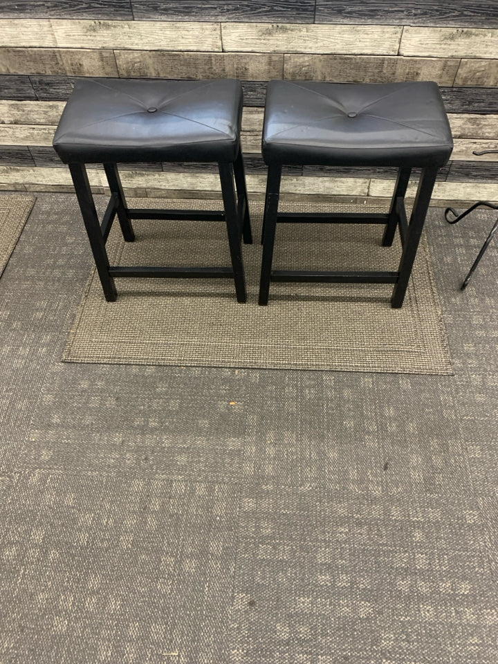 2 SADDLE BLACK FAUX LEATHER BAR STOOLS.