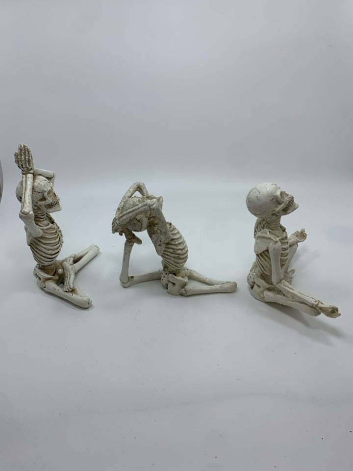 3 YOGA RESIN SKELETONS.