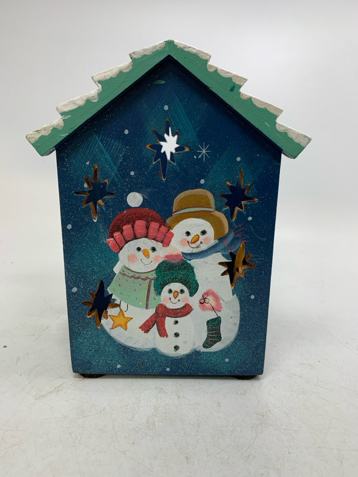 WOOD PAINTED HOUSE SNOWMAN FAMILY PILLAR CANDLE HOLDER W/ PIERCED STARS.