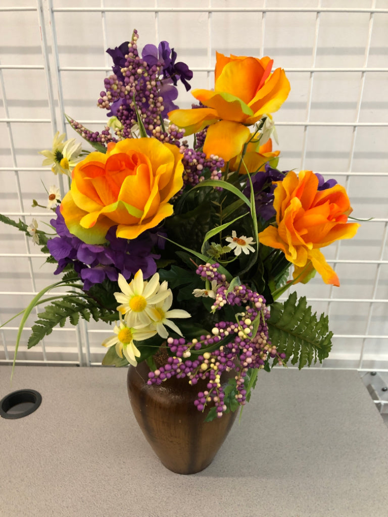 PURPLE/ORANGE FLOWERS IN BROWN VASE.
