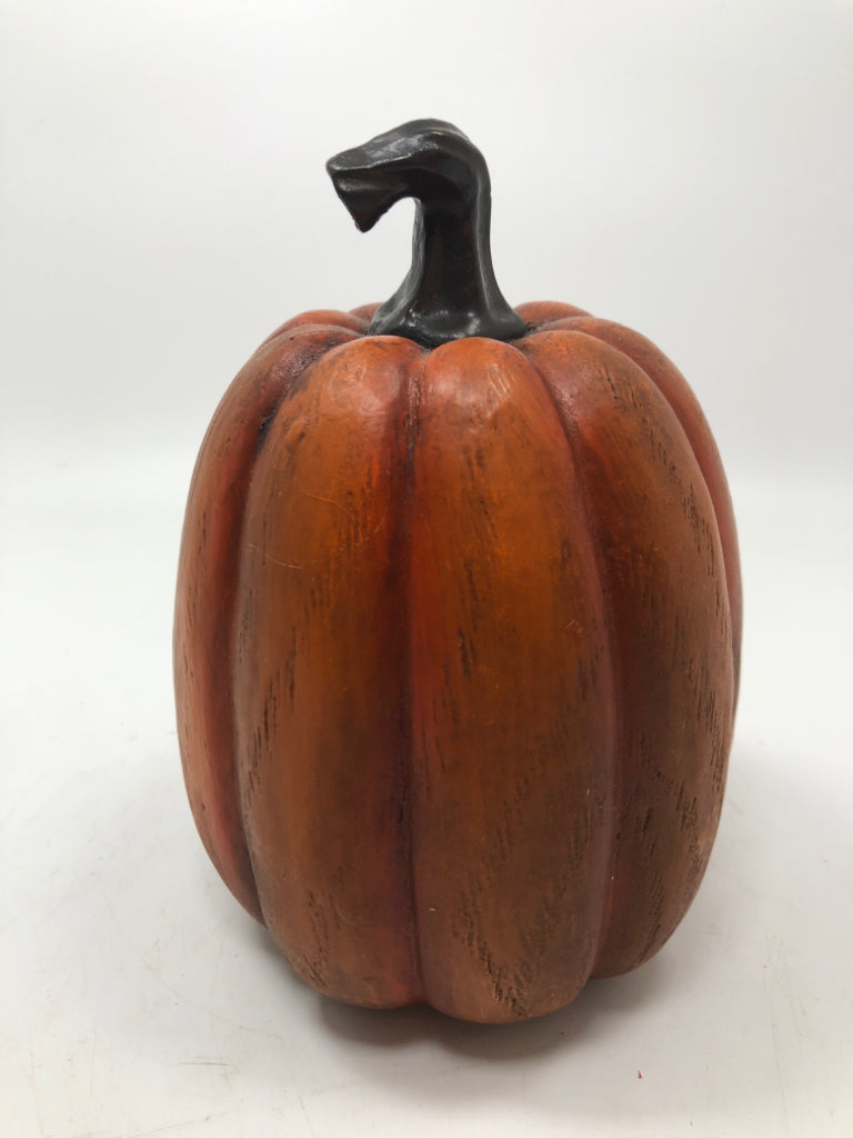 ORANGE PAINTED RESIN PUMPKIN.