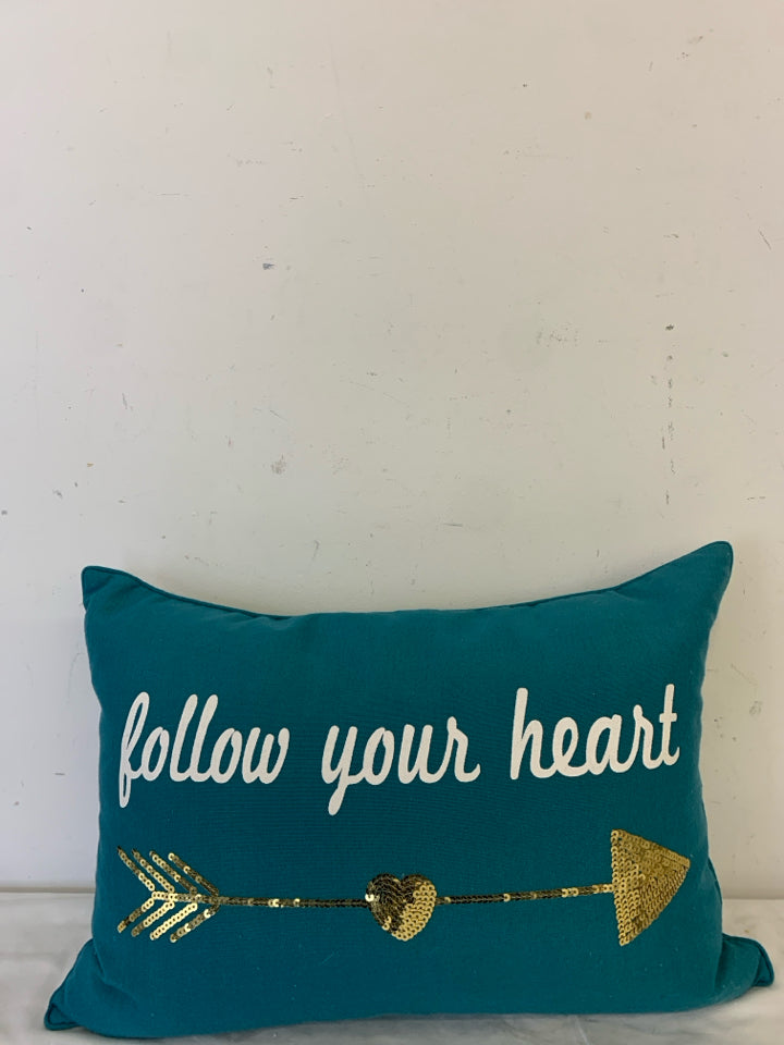 FOLLOW YOUR HEART TEAL PILLOW W/GOLD ARROW.