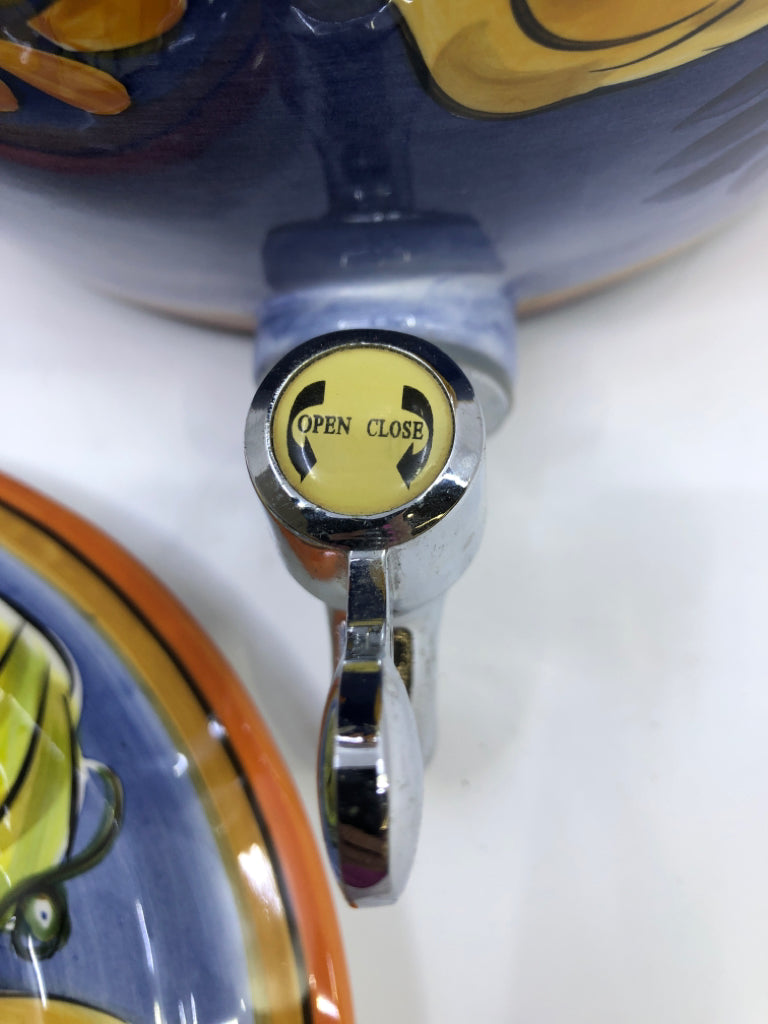 BLUE AND LEMON DRINK DISPENSER.