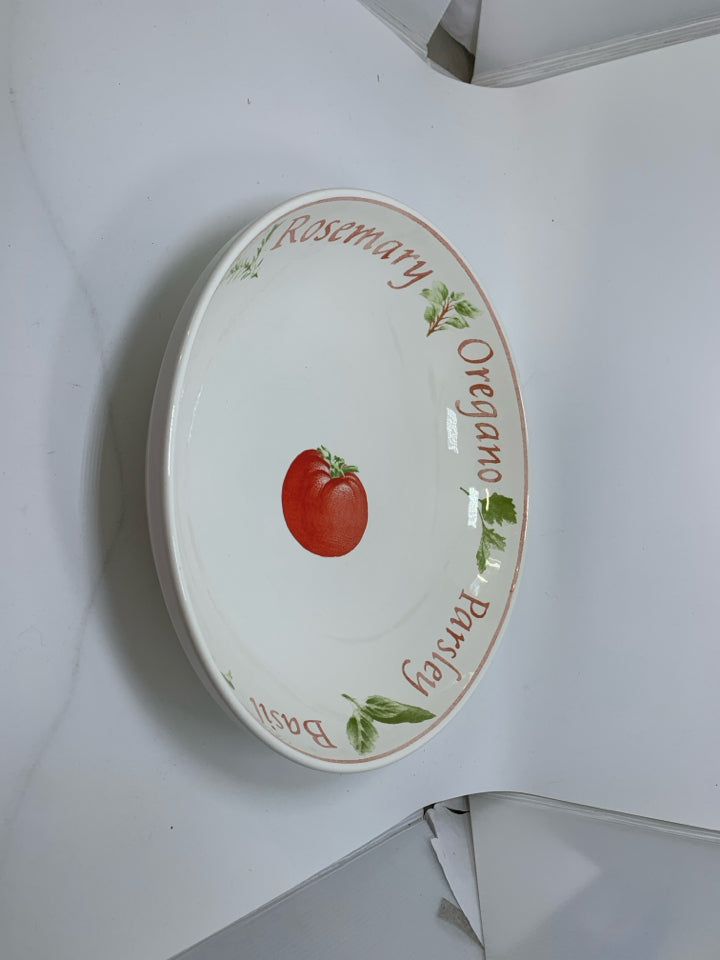 LARGE PASTA BOWL W/ TOMATO IN CENTER W/ HERB THEMED BOARDER.