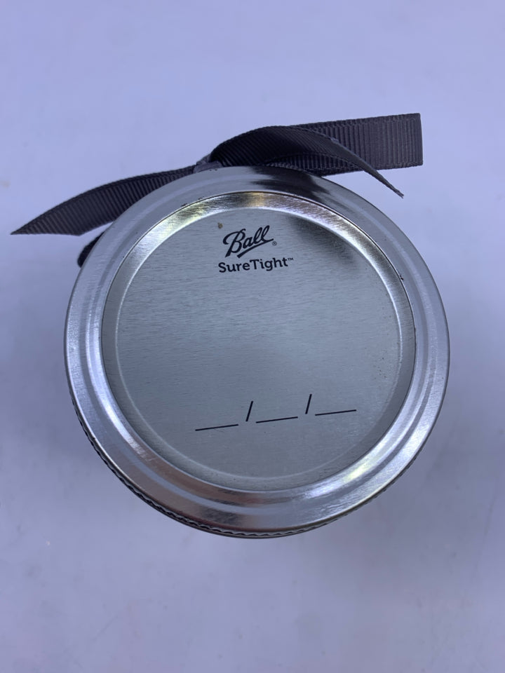 BALL JAR W/LID FILLED WITH DICE.