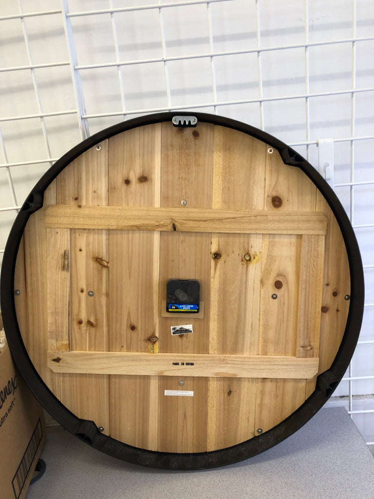 LARGE WOOD CLOCK W/ROMAN NUMERALS & BLACK BORDER.