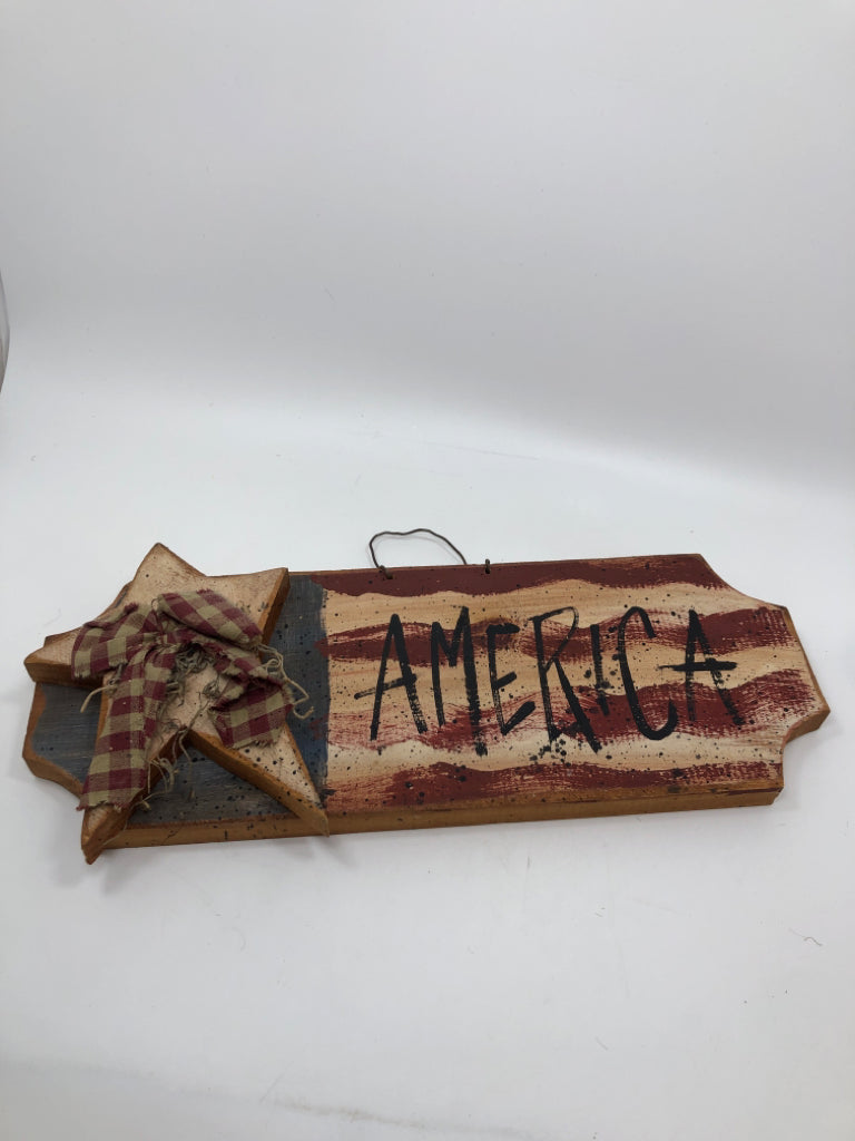 PRIMITIVE AMERICA SIGN W/WOOD STAR AND PLAID BOW.
