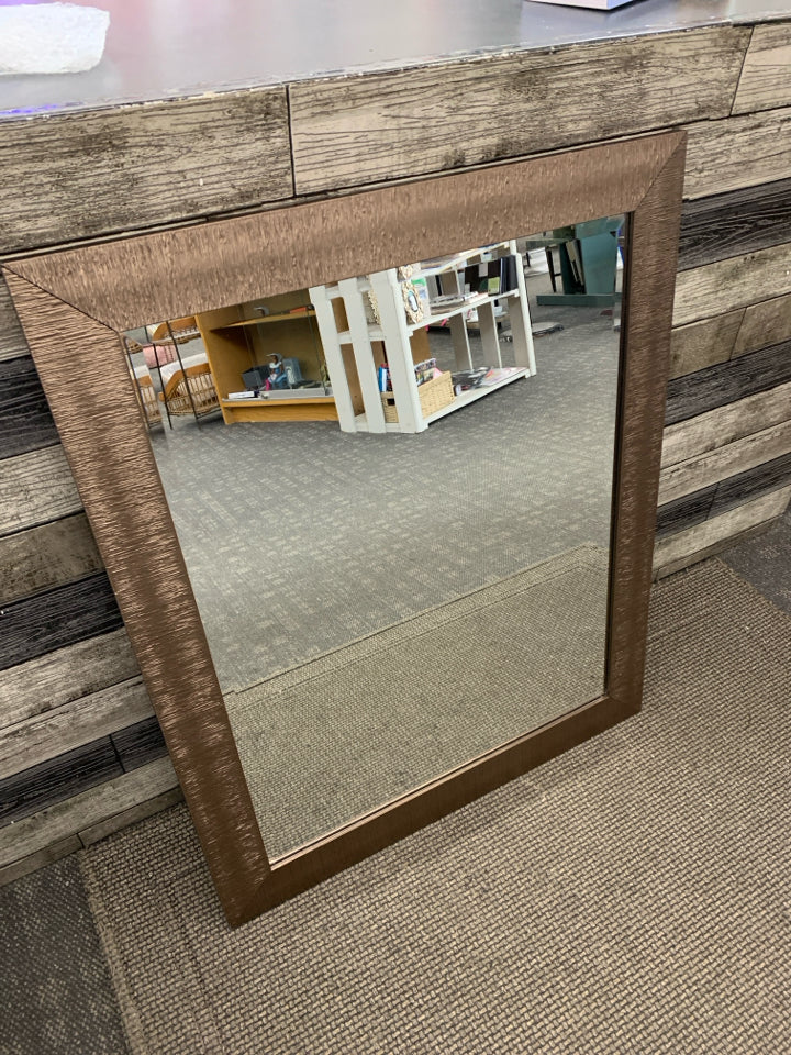 LARGE MIRROR W/BROWN RIBBED FRAME.