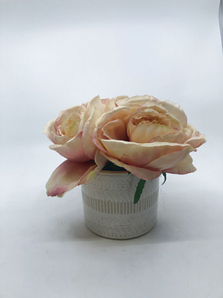 PINK YELLOW FLOWERS IN WHITE VASE.