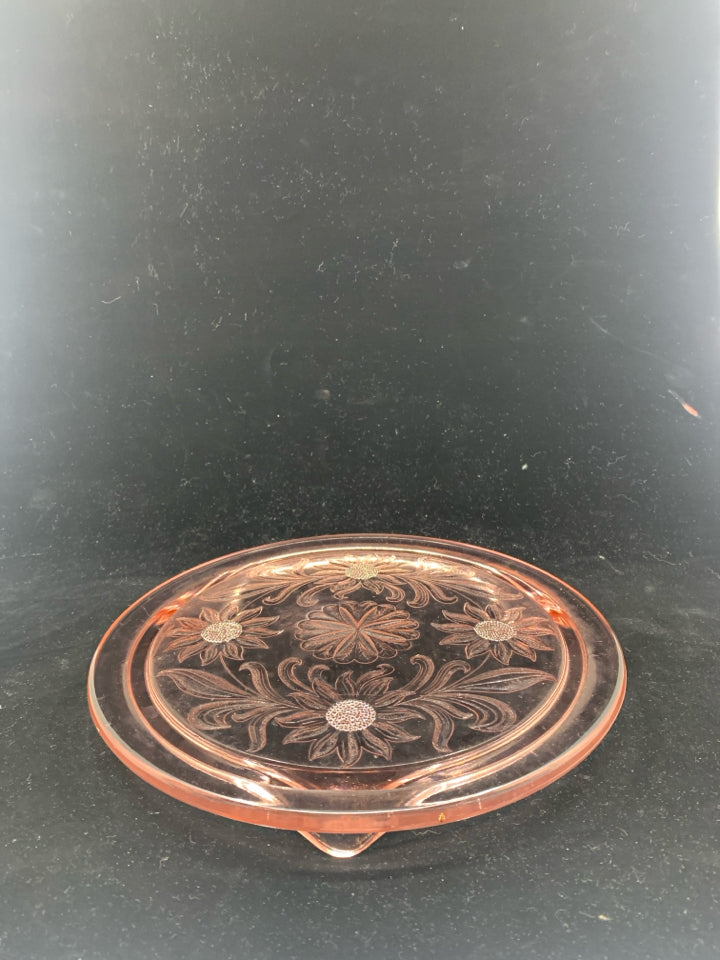 FOOTED PINK GLASS CIRCLE PLATTER W/ EMBOSSED FLOWERS.