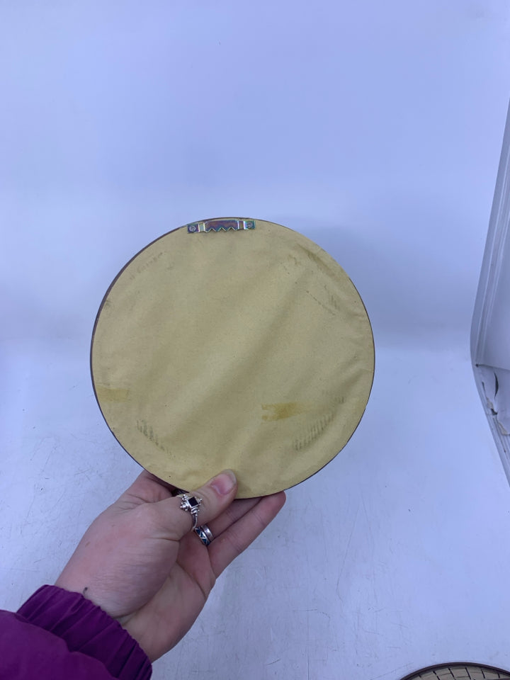 SMALL SILVER SCROLL W/ BROWN EDGE MIRROR.