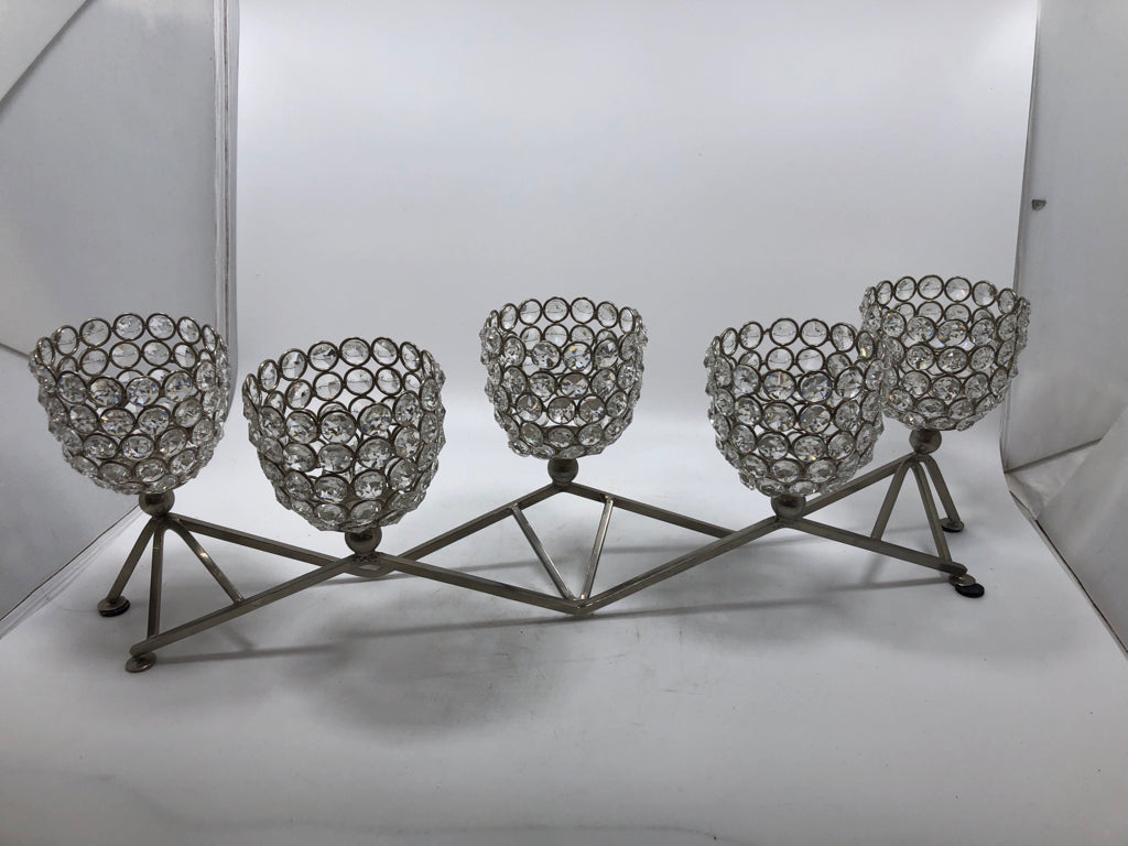 SILVER METAL AND CLEAR BEADED VOTIVE CANDLE HOLDER.