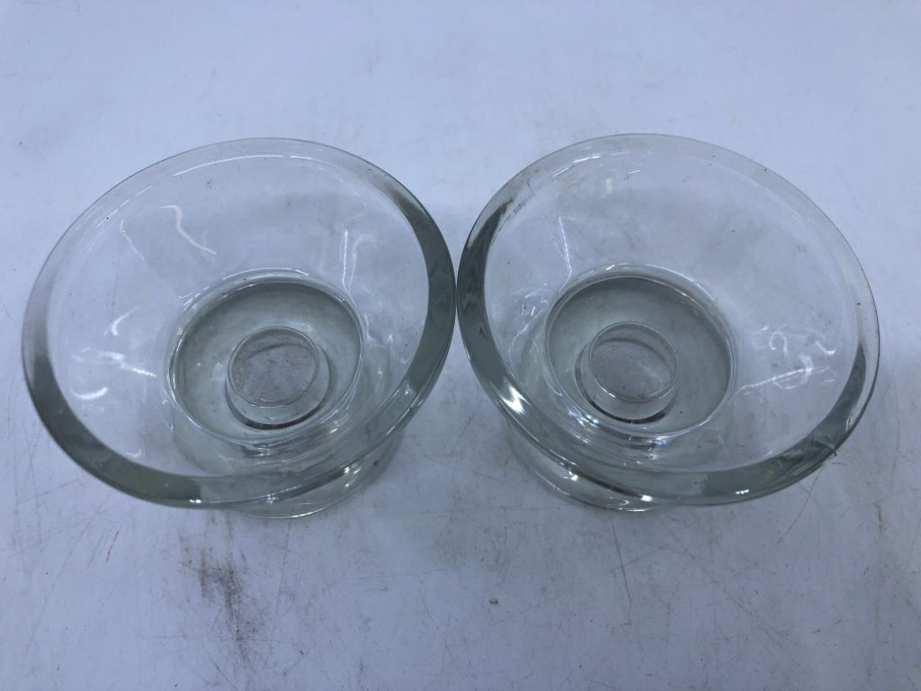 2 SMALL GLASS CANDLE HOLDERS.