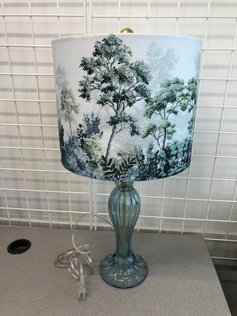 LT BLUE GLASS LAMP W/BOTANICAL SHADE.