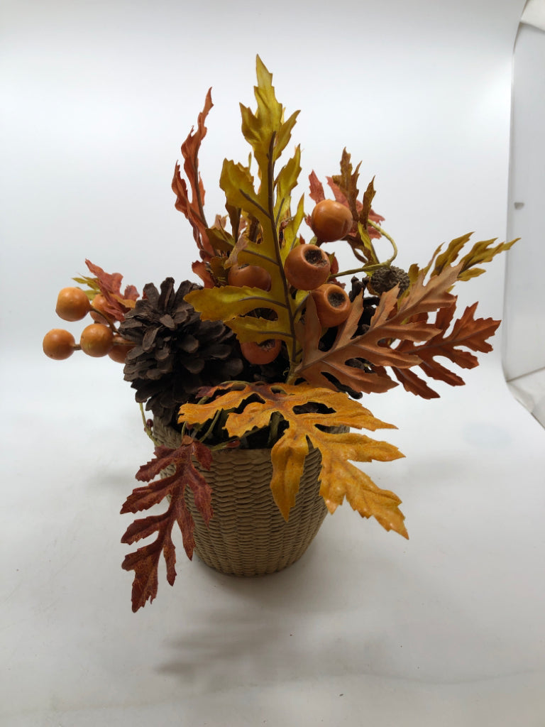 AUTUMN LEAVES/PINECONES IN WOVEN STONE VASE.