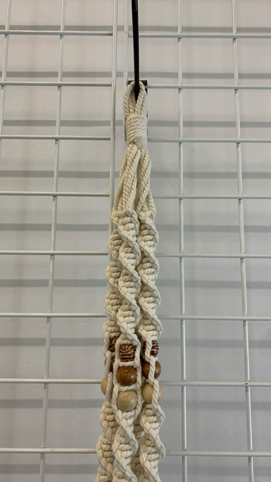 BEADED MACRAME PLANT HOLDER.
