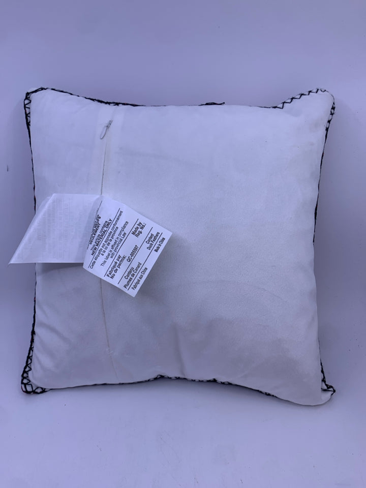 RED BUFFALO PLAID ACCENT PILLOW WITH SNOWFLAKES.