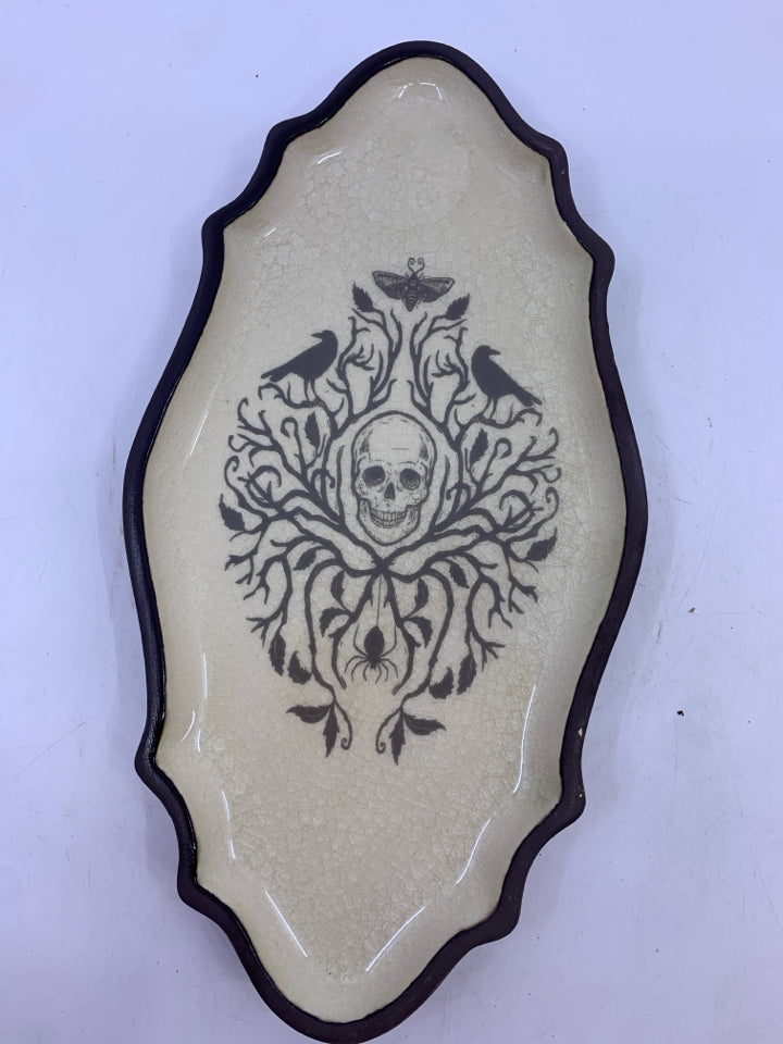 SKELETON AND CROWS GLAZED TOP CERAMIC DISH.