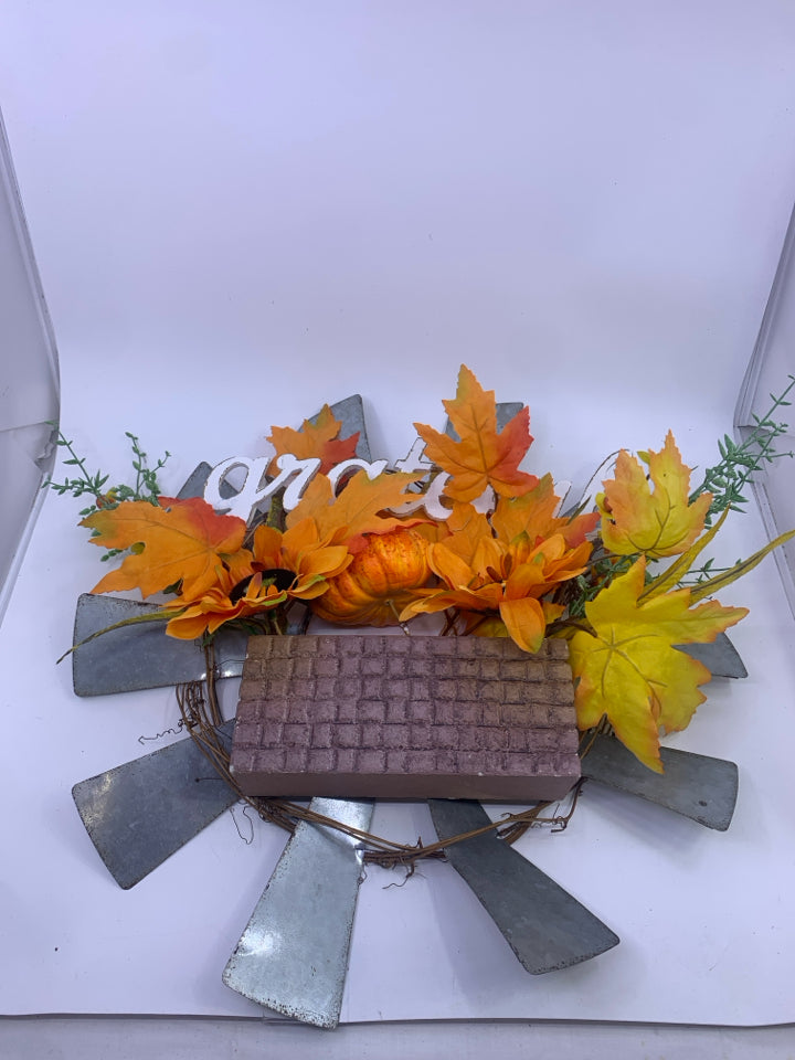 GRATEFUL METAL SUN WREATH W/ ORANGE LEAVES.