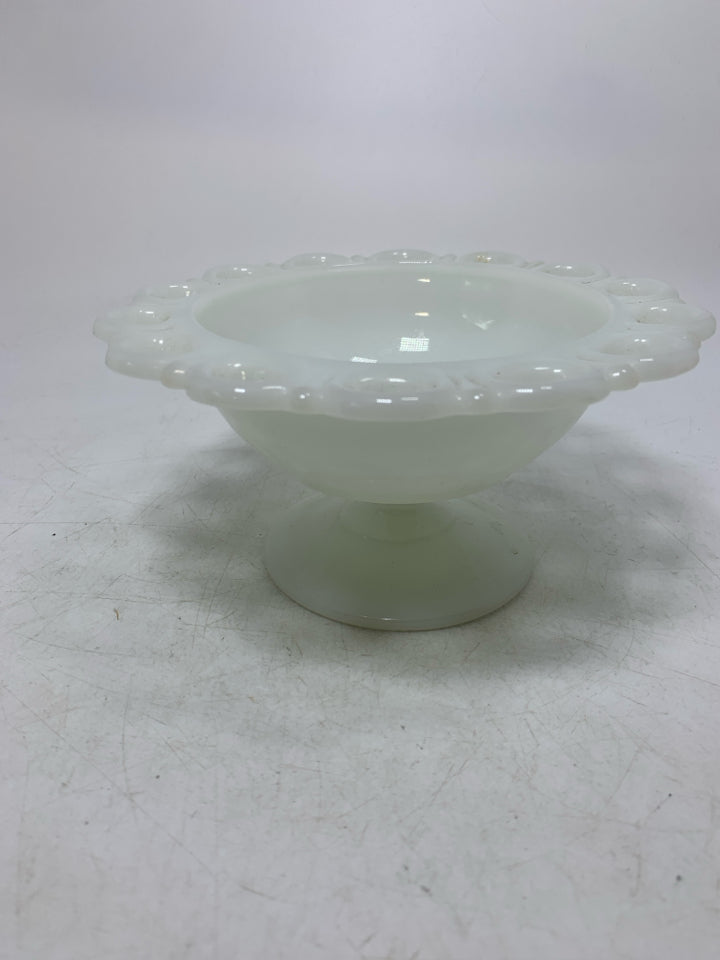 FOOTED MILK GLASS CANDY DISH W/ PIERCED EDGE.