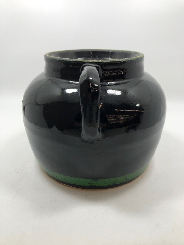 BLACK GLAZED JUG W/HANDLES AND GREEN.