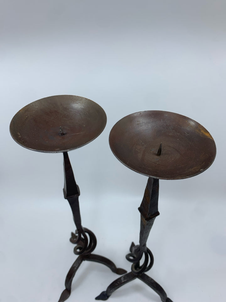 2 BROWN METAL PILLAR CANDLE HOLDERS.