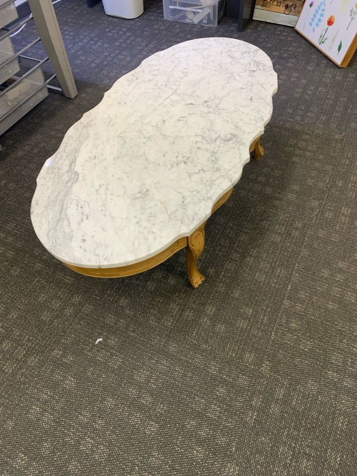 MARBLE OVAL TABLE W/ CLAW FOOT WOOD BASE.