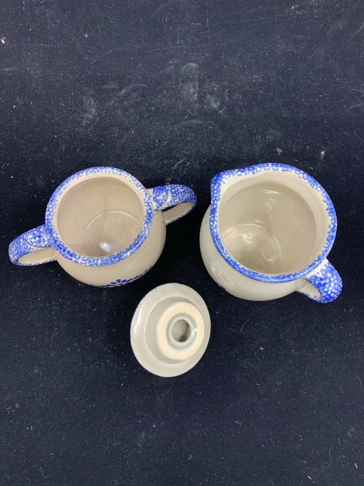 CREAM AND BLUE POTTERY CREAMER AND SUGAR.