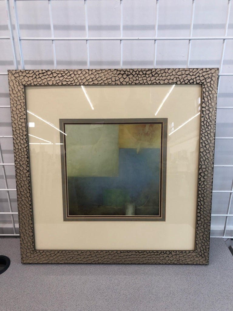 BLUE/GREEN ABSTRACT PRINT IN GOLD PAINTED FRAME.