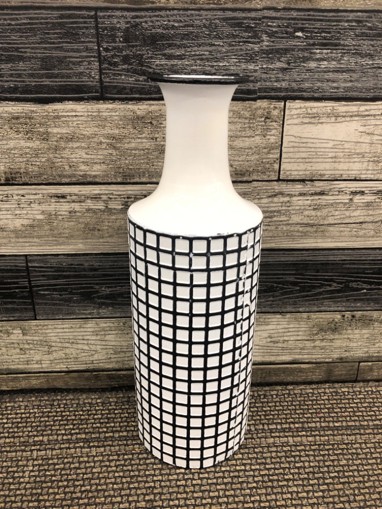 WHITE AND BLACK METAL VASE.