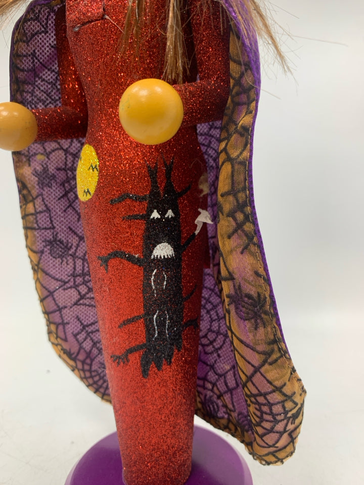 WITCH IN GLITTER DRESS.