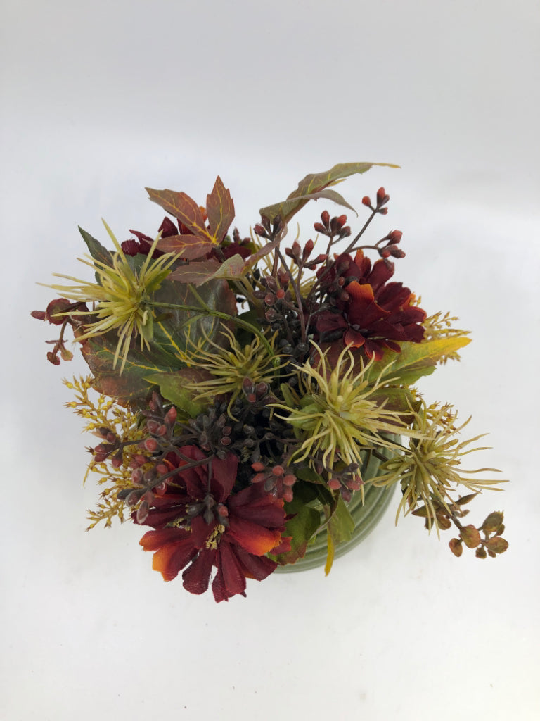 GREEN CERAMIC RIBBED VASE W/FAUX FLORALS.