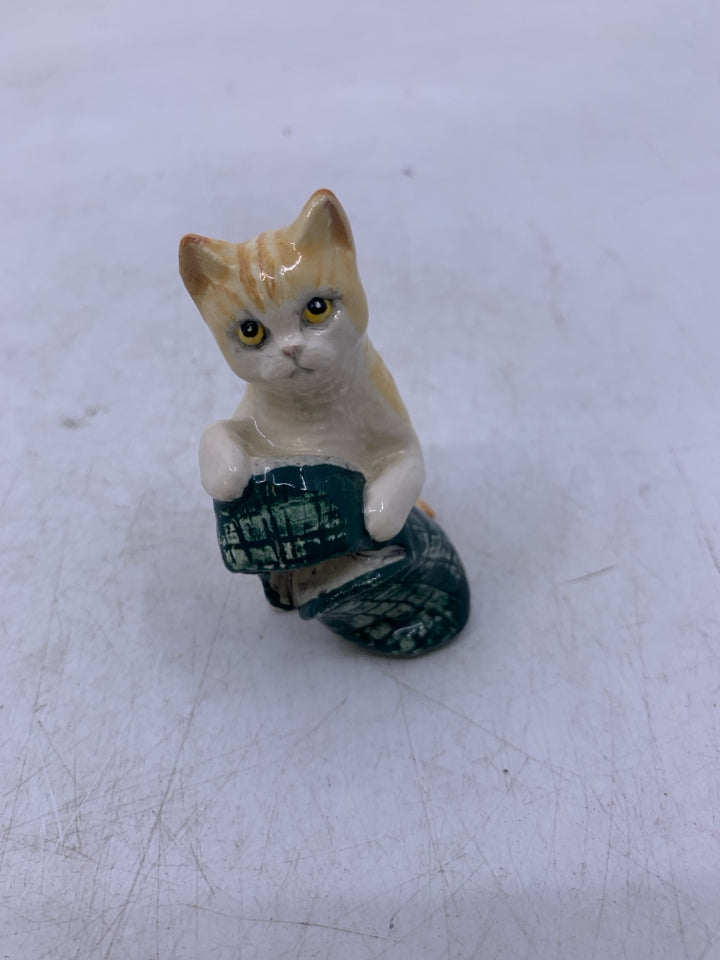 PORCELAIN CAT WITH SLIPPER.