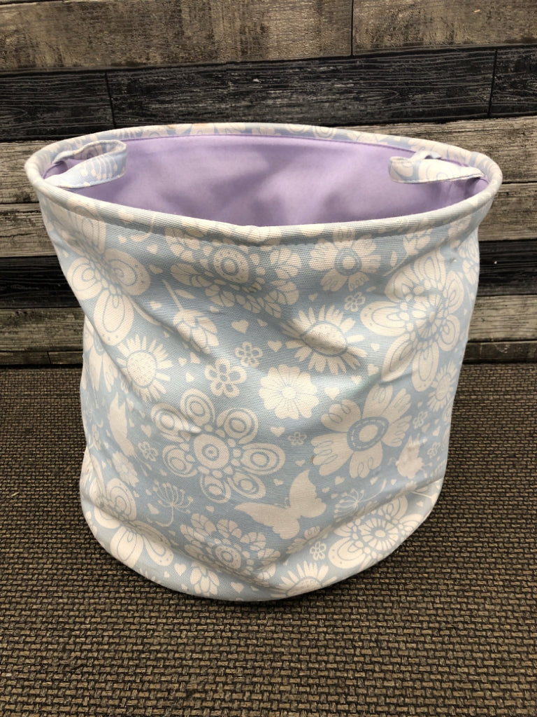 BLUE FLORAL CLOTH HAMPER.
