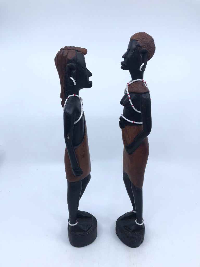 2-WOODEN MAN AND WOMAN CARVED FIGURES W BEADED JEWELRY.