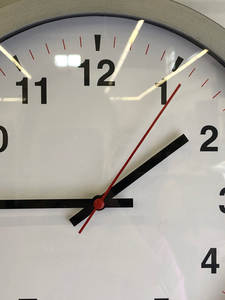 SILVER PLASTIC CLOCK.