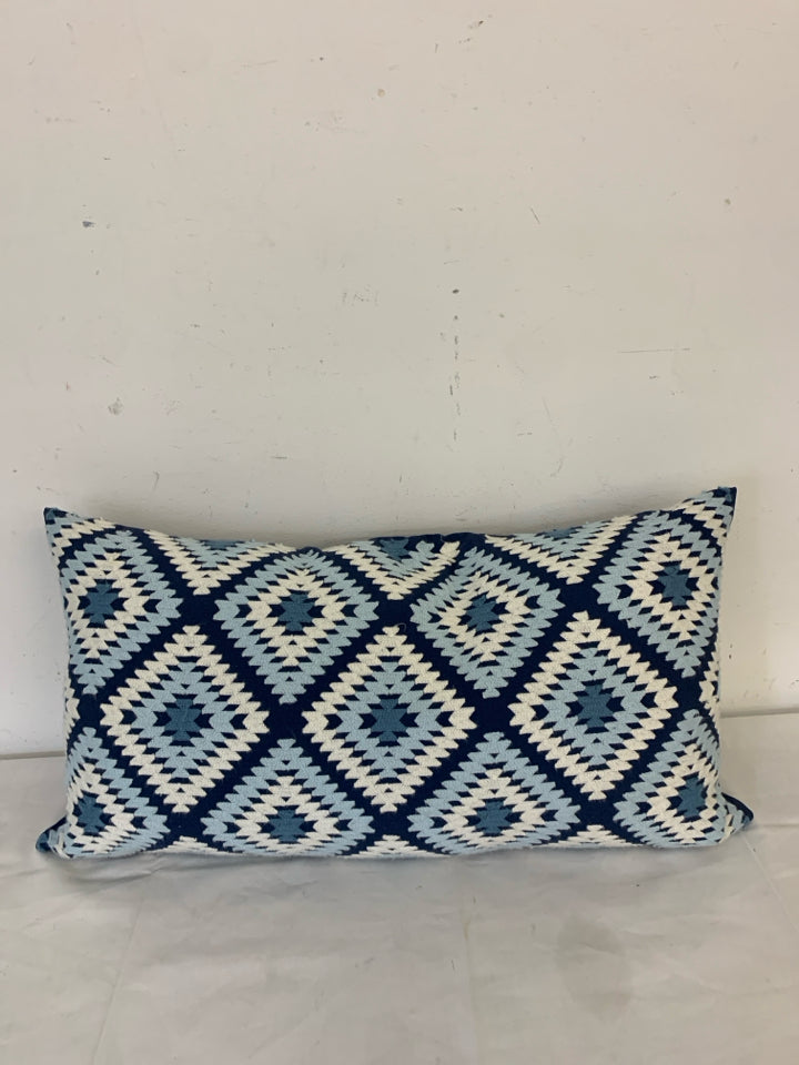 LONG DARK BLUE PILLOW W/ LIGHT BLUE/WHITE WOVEN DIAMOND PATTERN.