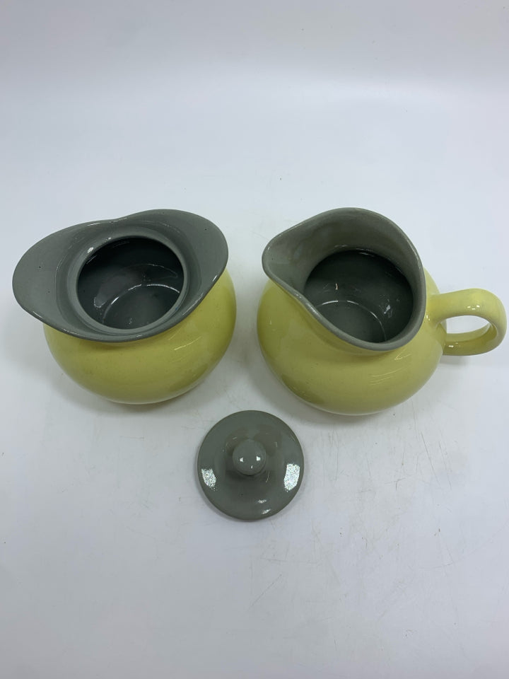 YELLOW CERAMIC CREAMER/SUGAR SET W/GRAY LID.
