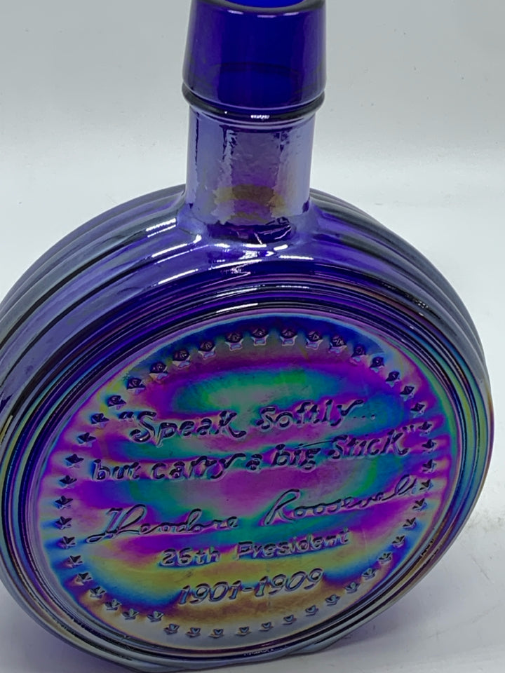 VTG PURPLE IRIDESCENT GLASS ROOSEVELT EMPTY BOTTLE.