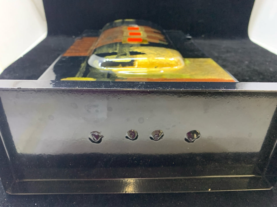 BLACK METAL THIN VASE W/GOLD ACCENTS.