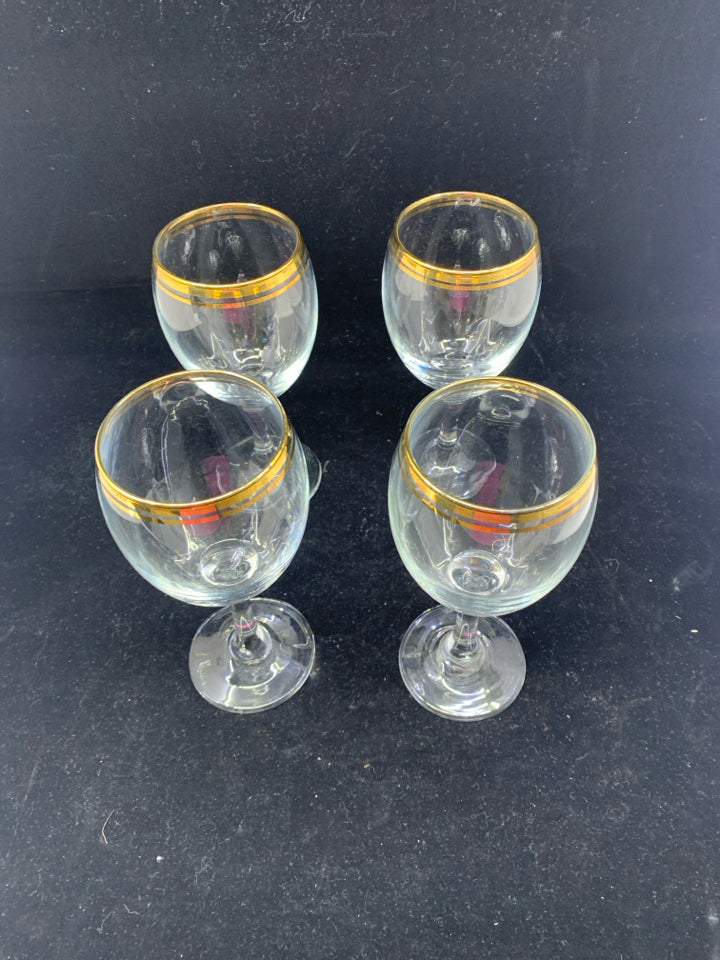 4 GOLD RIMMED WINE GLASSES.