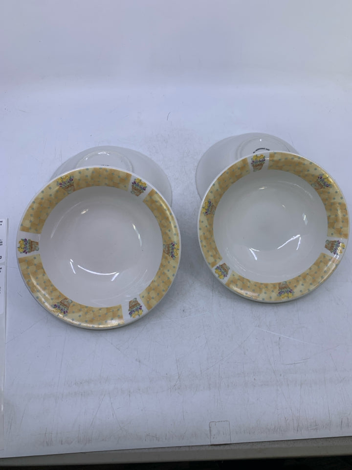 4 CEREAL BOWLS W/ YELLOW RIM W/ PLANTED FLOWERS.