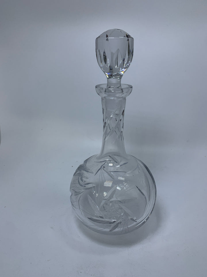 HEAVY CRYSTAL DECANTER W/ ETCHED STAR DESIGNS.