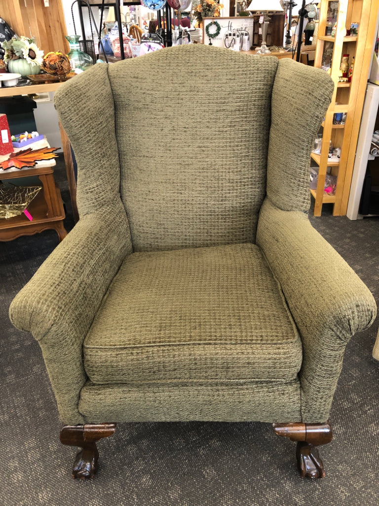 GREEN WING BACK CHAIR W DARK WOOD LEGS.