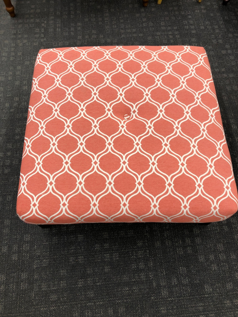 CORAL OTTOMAN W/WHITE DIAMOND DESIGN.