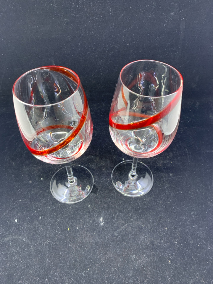 2 LARGE WINE GLASSES W RED SWIRL.